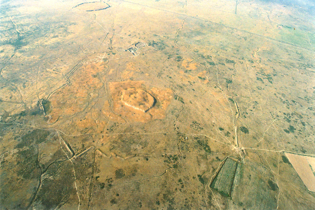 Three parts of Karatobe medieval city (Early Sauran): citadel, shahristan, ribad. The distant object – Sauran medieval city. Air photo (2006).